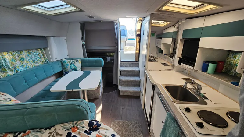 Slide: The Image of Interior of a 1994 Formula 31 PC boat with modern kitchen and seating area. - 17