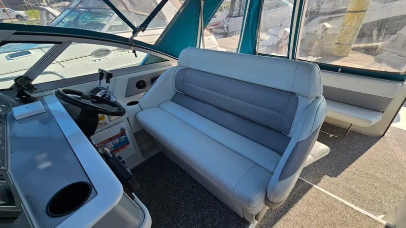 Slide: The Image of 1994 Formula 31 PC boat interior with helm and seating area. - 9