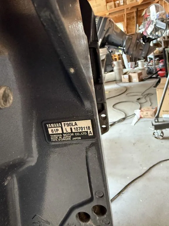 Slide: The Image of Yamaha F90LA engine label in a garage, near Bennington 21 SLX, 2015 model. - 11