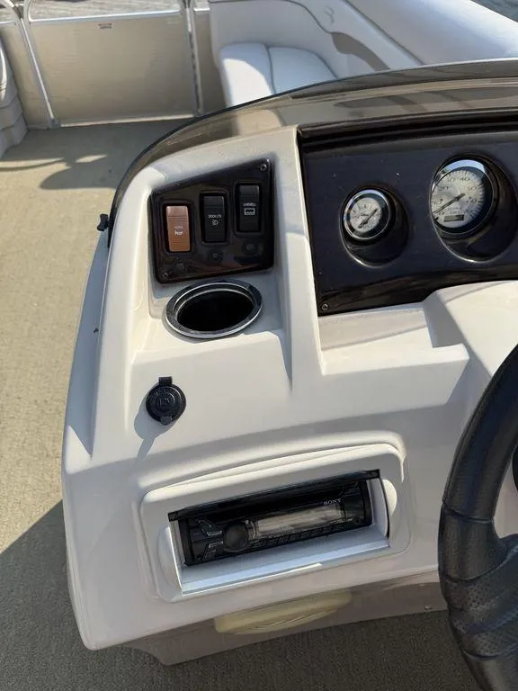 Slide: The Image of Dashboard of a 2015 Bennington 21 SLX boat with gauges and controls. - 21