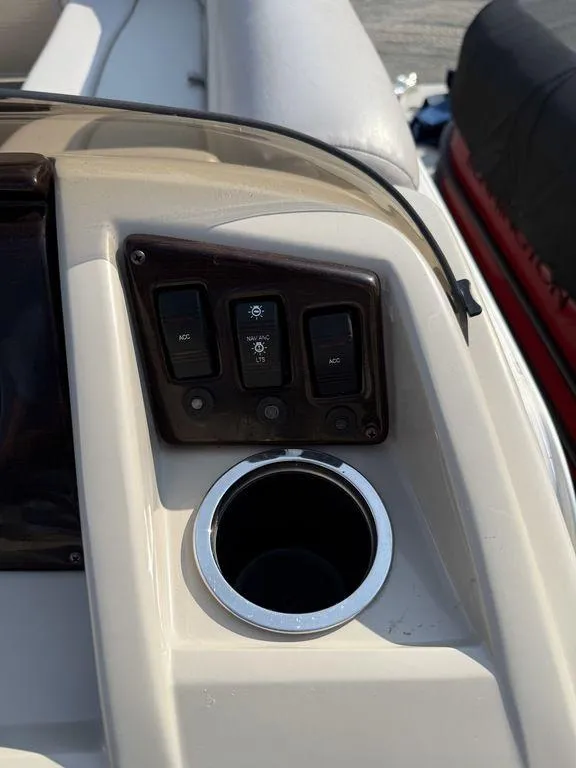 Slide: The Image of Control panel and cup holder on 2015 Bennington 21 SLX boat. - 24