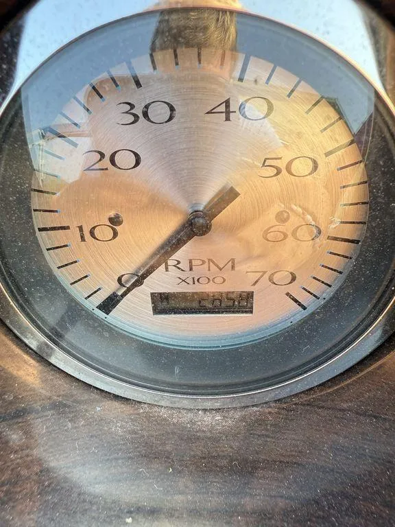 Slide: The Image of Close-up of a Bennington 21 SLX 2015 tachometer showing RPM readings. - 26