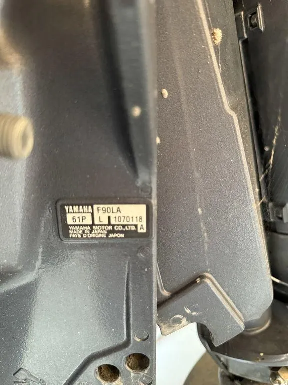 Slide: The Image of Close-up of Yamaha F90LA engine label on a 2015 Bennington 21 SLX boat. - 8