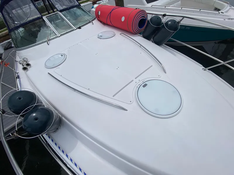 Slide: The Image of 2006 Four Winns 348 Vista boat deck with fenders and rolled mats. - 13