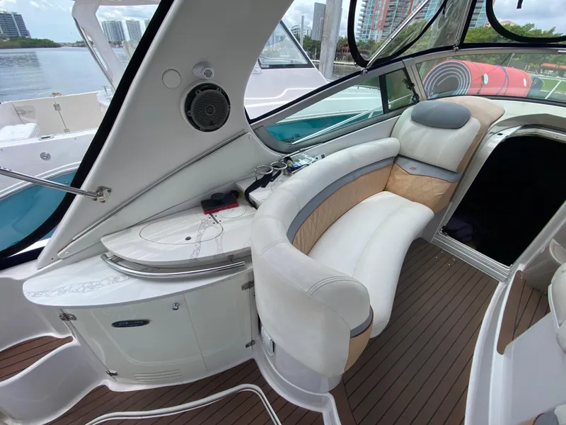 Slide: The Image of 2006 Four Winns 348 Vista boat interior with curved seating and modern design. - 18