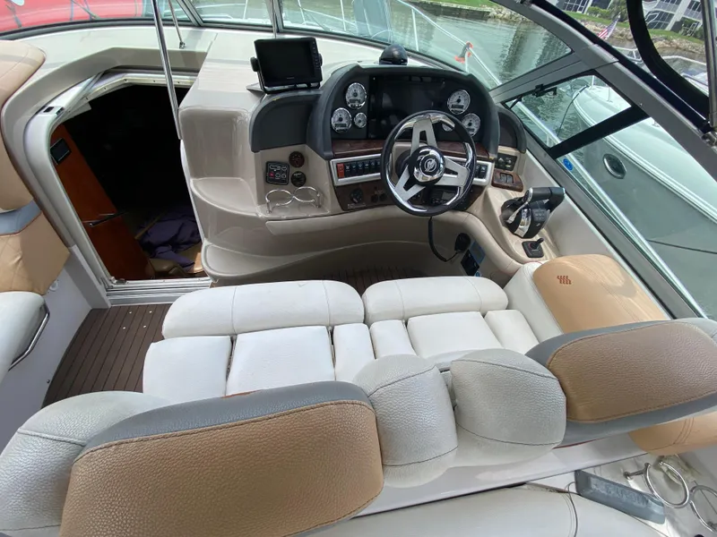Slide: The Image of Helm of 2006 Four Winns 348 Vista boat with steering wheel and control panel. - 21