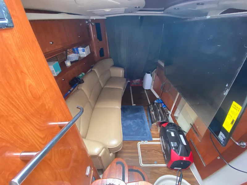 Slide: The Image of Interior of 2006 Four Winns 348 Vista boat with leather seating and wooden cabinetry. - 23