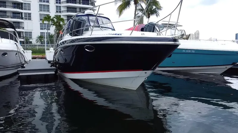 Slide: The Image of 2006 Four Winns 348 Vista boat docked near waterfront buildings. - 7