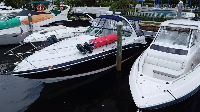 Slide: The Image of 2006 Four Winns 348 Vista yacht docked alongside other boats in a marina. - 9