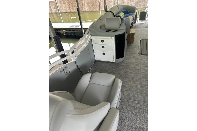 Slide: The Image of Interior of 2025 JC NEPTOON 27TT SPORT boat with gray seating and storage compartments. - 10