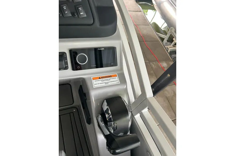 Slide: The Image of Control panel of 2025 JC NEPTOON 27TT SPORT boat with warning label and throttle. - 14