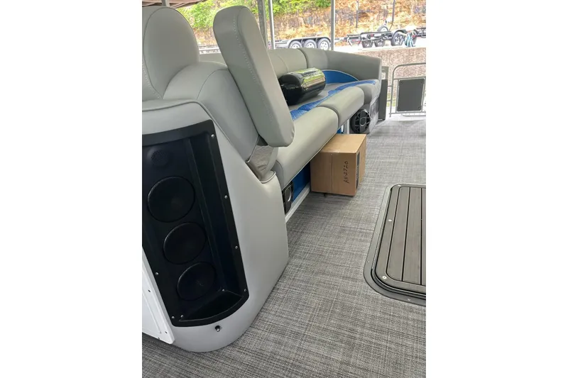 Slide: The Image of Interior of 2025 JC NEPTOON 27TT SPORT boat with gray seating and speaker system. - 16