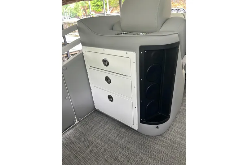 Slide: The Image of Interior of 2025 JC NEPTOON 27TT SPORT boat with storage drawers and cup holders. - 17