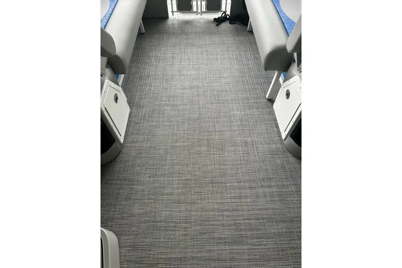 Slide: The Image of Interior view of 2025 JC NEPTOON 27TT SPORT boat with gray flooring and seating. - 19