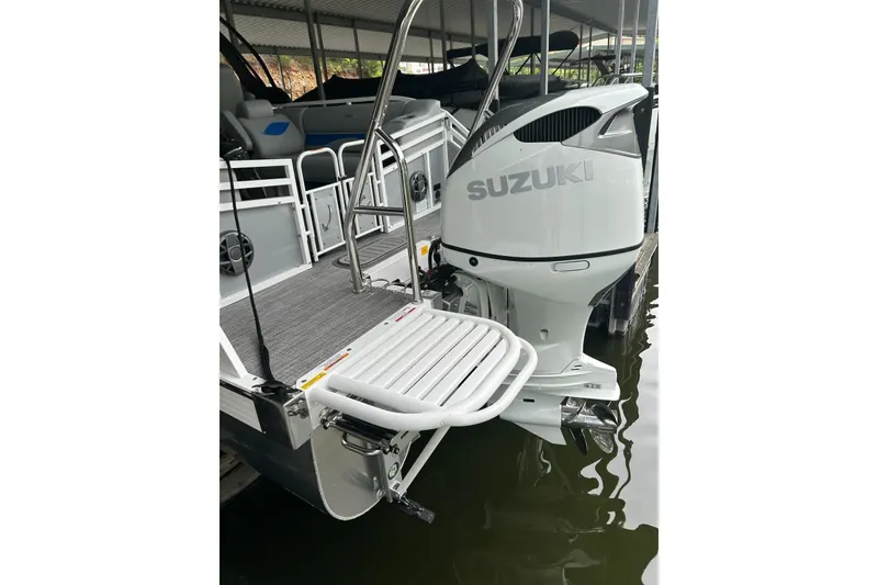 Slide: The Image of 2025 JC NEPTOON 27TT SPORT boat with Suzuki outboard motor at dock. - 21