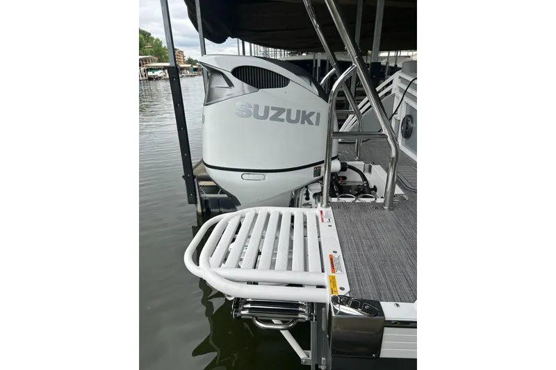 Slide: The Image of 2025 JC NEPTOON 27TT SPORT boat with Suzuki outboard motor at dock. - 25
