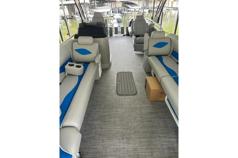 Slide: The Image of Interior of 2025 JC NEPTOON 27TT SPORT boat with gray and blue seating. - 3