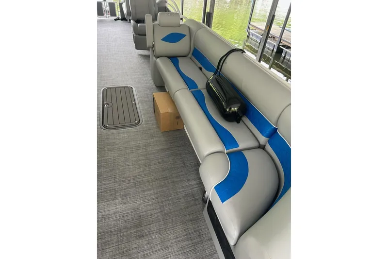 Slide: The Image of Interior of 2025 JC NEPTOON 27TT SPORT boat with gray and blue seating. - 4