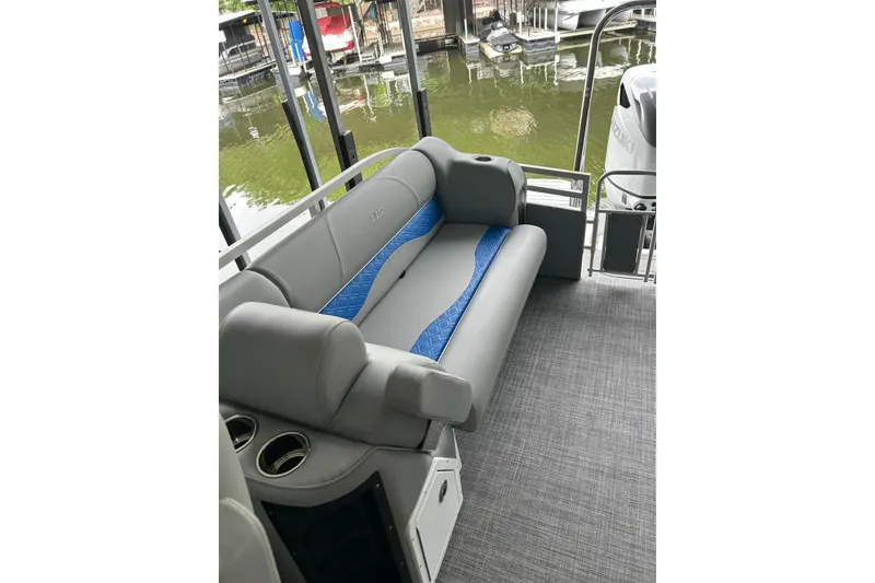 Slide: The Image of Luxury seating on 2025 JC NEPTOON 27TT SPORT pontoon boat, featuring gray and blue upholstery. - 7
