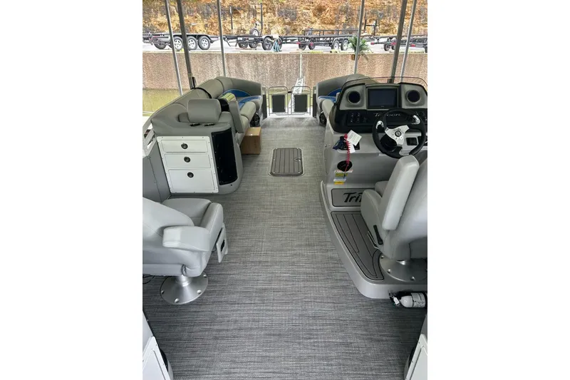 Slide: The Image of Interior of 2025 JC NEPTOON 27TT SPORT boat with modern seating and controls. - 9