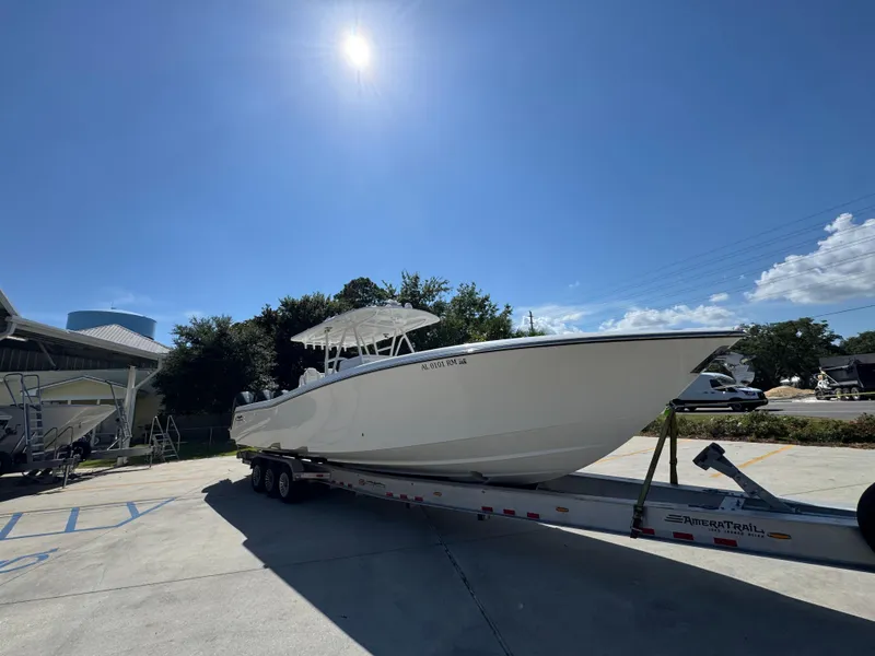 Slide: The Image of 2020 Invincible 39 Open Fisherman boat on trailer under sunny sky. - 10