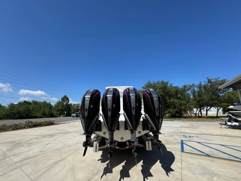 Slide: The Image of 2020 Invincible 39 Open Fisherman with four powerful outboard engines, parked outdoors. - 20