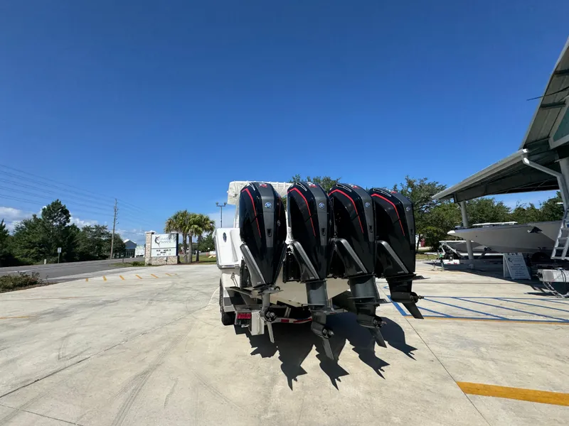 Slide: The Image of 2020 Invincible 39 Open Fisherman with four powerful outboard engines, parked outdoors. - 21