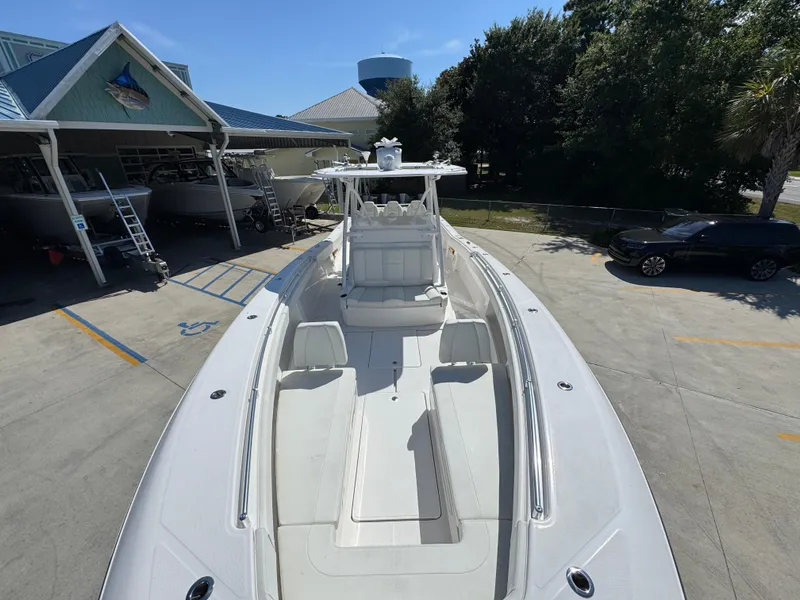 Slide: The Image of 2020 Invincible 39 Open Fisherman boat docked at a marina under clear skies. - 29