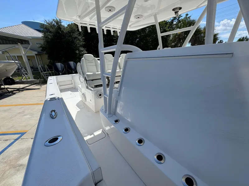 Slide: The Image of 2020 Invincible 39 Open Fisherman boat interior with seating and rod holders. - 33