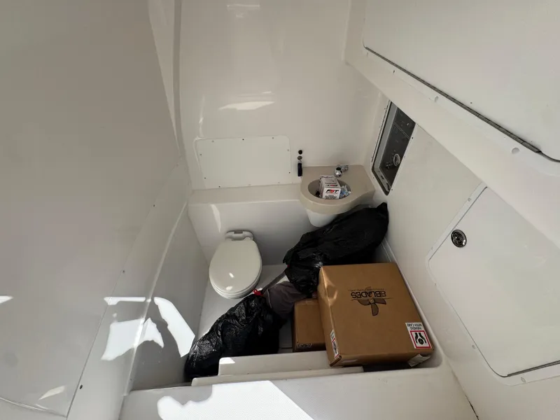 Slide: The Image of Interior of 2020 Invincible 39 Open Fisherman boat with toilet and storage items. - 34