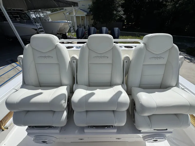 Slide: The Image of Three luxurious white seats on a 2020 Invincible 39 Open Fisherman boat. - 37