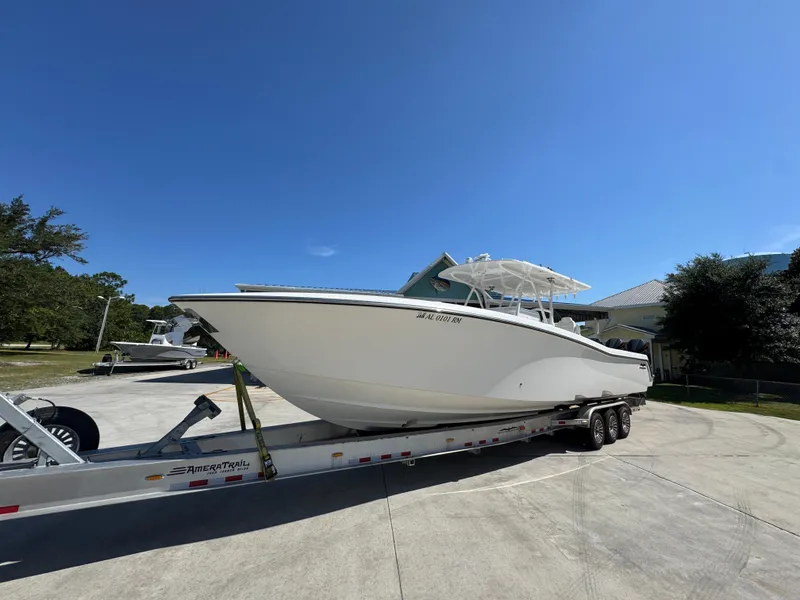 Slide: The Image of 2020 Invincible 39 Open Fisherman boat on trailer under clear blue sky. - 4