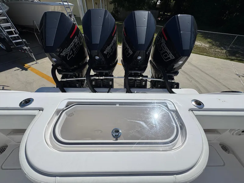 Slide: The Image of Four powerful outboard engines on a 2020 Invincible 39 Open Fisherman boat. - 45