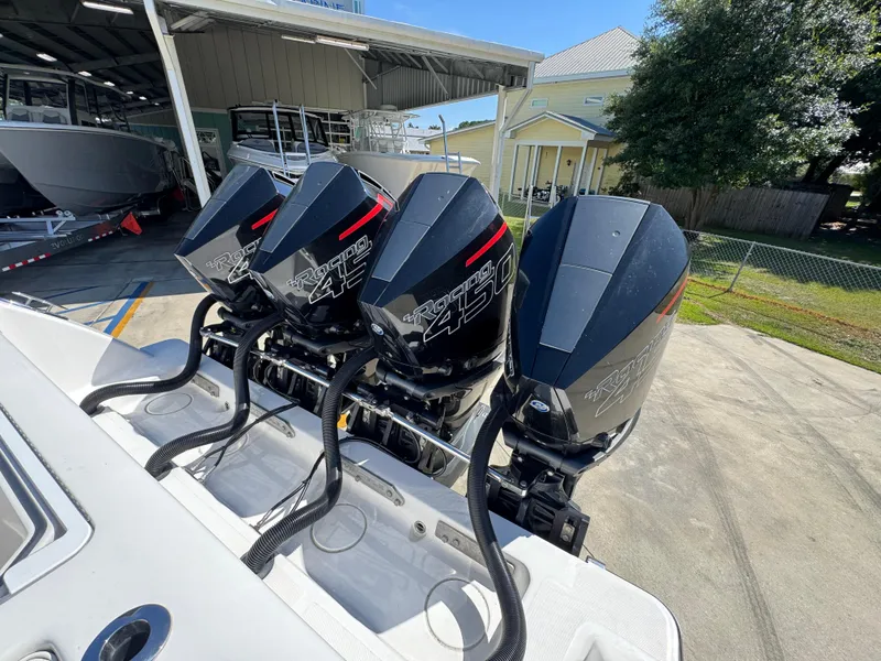 Slide: The Image of Four powerful outboard engines on a 2020 Invincible 39 Open Fisherman boat. - 46