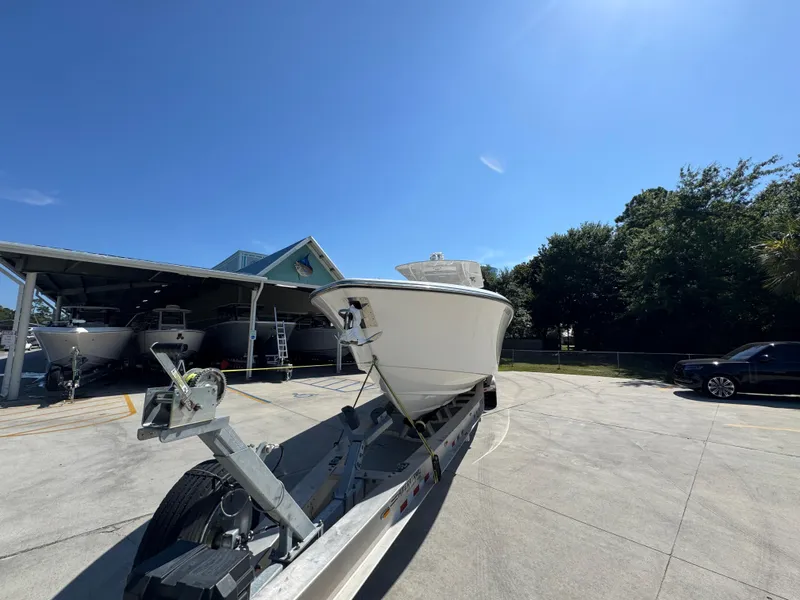 Slide: The Image of 2020 Invincible 39 Open Fisherman boat on trailer under clear blue sky. - 7
