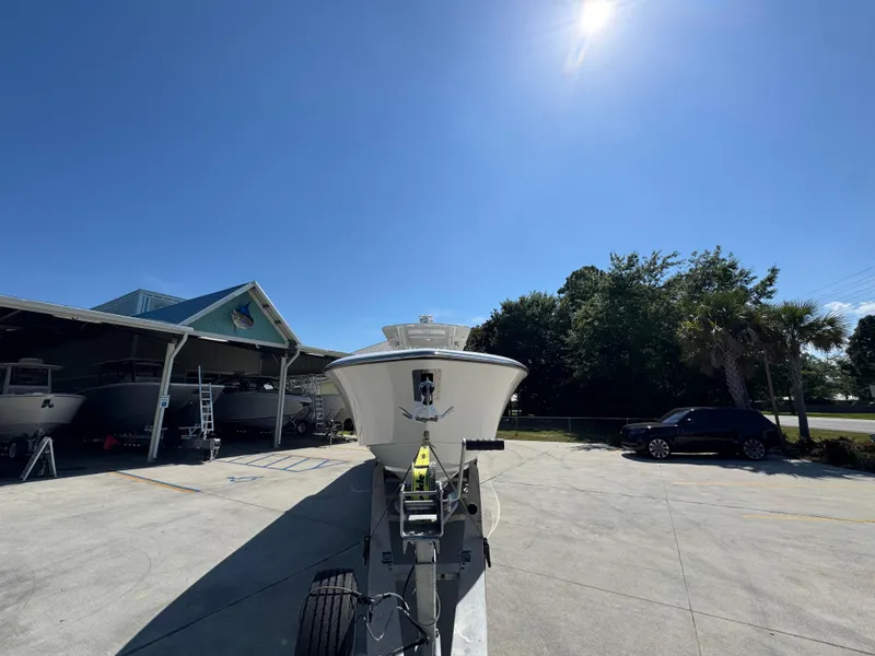 Slide: The Image of 2020 Invincible 39 Open Fisherman boat on trailer under clear blue sky. - 8