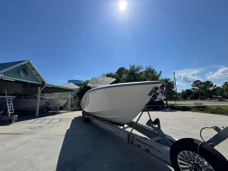 Slide: The Image of 2020 Invincible 39 Open Fisherman boat on trailer under clear blue sky. - 9