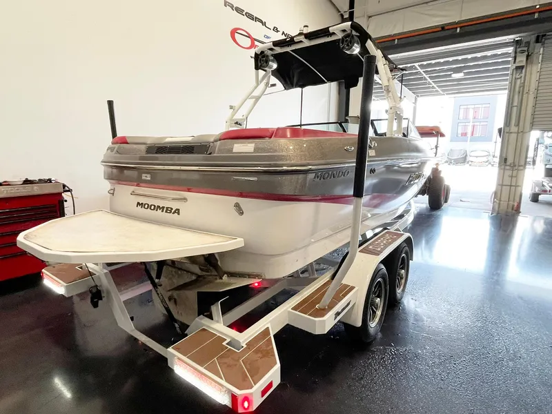 Slide: The Image of 2016 Moomba Mondo boat on trailer in a garage setting. - 5