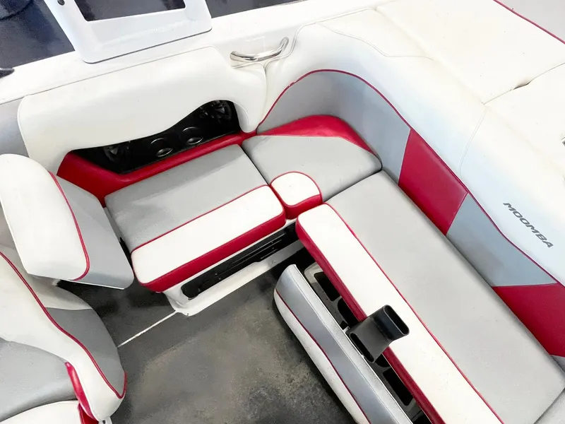 Slide: The Image of 2016 Moomba Mondo boat interior with red and gray seating. - 8