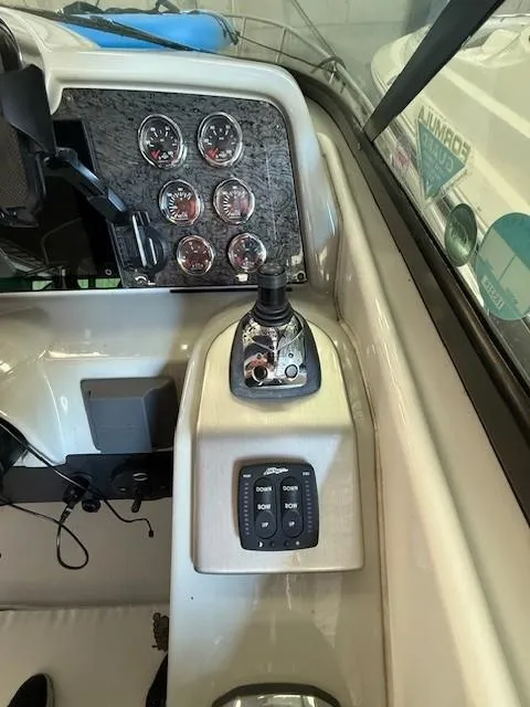 Slide: The Image of Control panel of a 2012 Formula 350 Sun Sport boat with gauges and switches. - 11