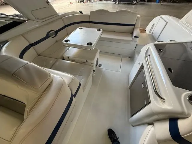 Slide: The Image of 2012 Formula 350 Sun Sport boat interior with seating and table in a spacious layout. - 20
