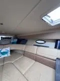 Slide: The Image of Interior of 2012 Formula 350 Sun Sport boat with beige seating and skylight. - 27