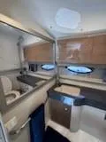 Slide: The Image of 2012 Formula 350 Sun Sport boat interior bathroom with modern fixtures and wood cabinetry. - 33