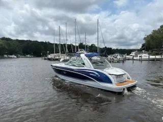 Slide: The Image of 2012 Formula 350 Sun Sport boat cruising on a calm river under cloudy skies. - 36