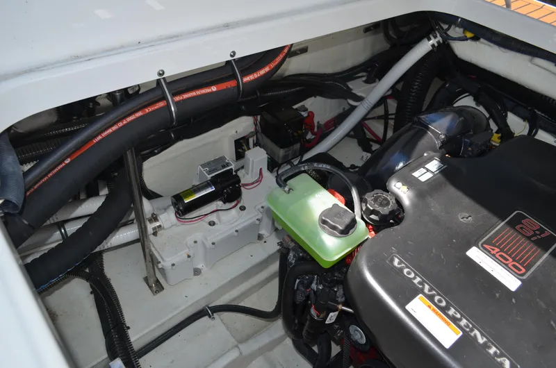 Slide: The Image of Engine compartment of a 2012 Formula 350 Sun Sport boat, featuring Volvo Penta components. - 43