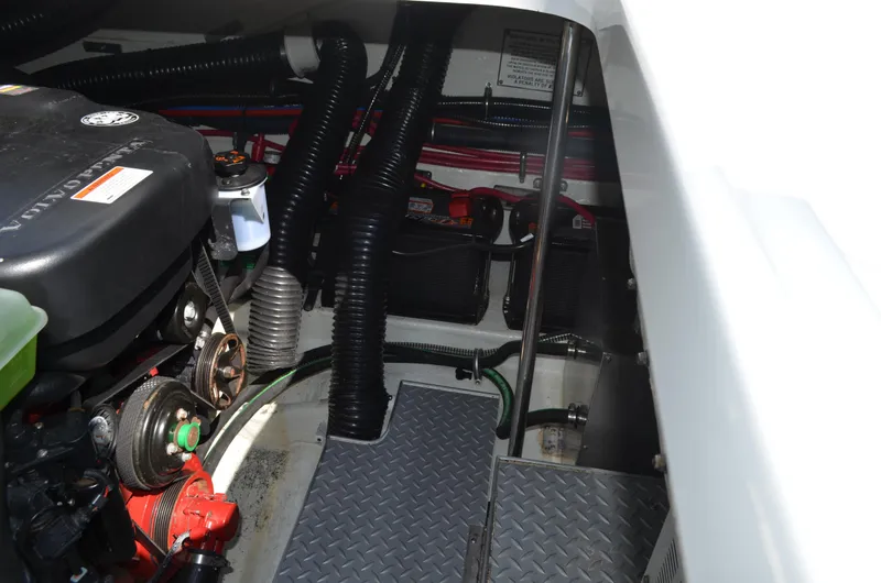 Slide: The Image of Engine compartment of a 2012 Formula 350 Sun Sport boat, showcasing mechanical components and wiring. - 44