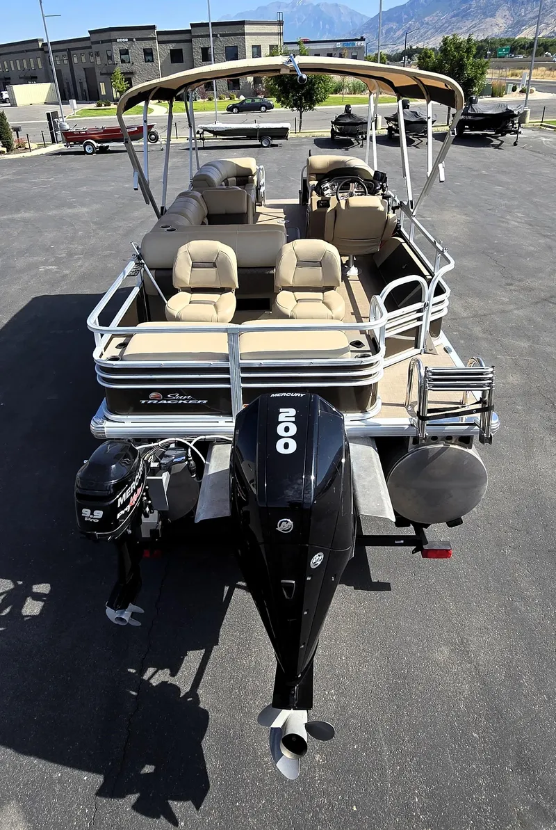 Slide: The Image of 2023 Sun Tracker SportFish 22 XP3 pontoon boat with dual engines and spacious seating. - 12