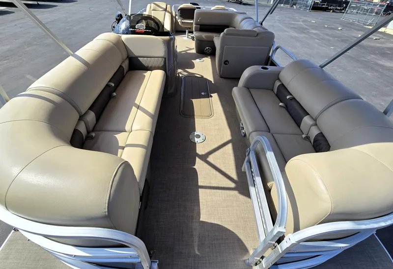 Slide: The Image of 2023 Sun Tracker SportFish 22 XP3 pontoon boat interior with beige seating and spacious layout. - 14