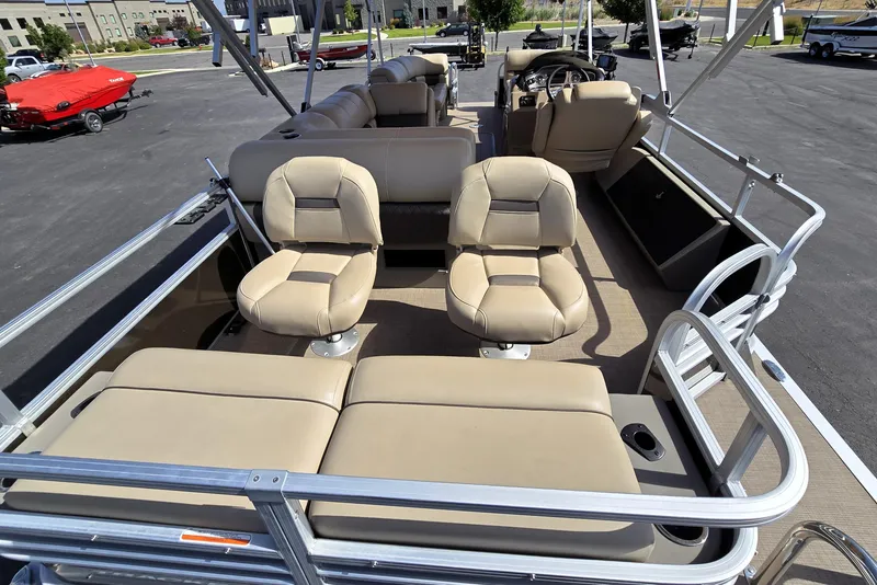 Slide: The Image of 2023 Sun Tracker SportFish 22 XP3 pontoon boat interior with beige seating. - 18