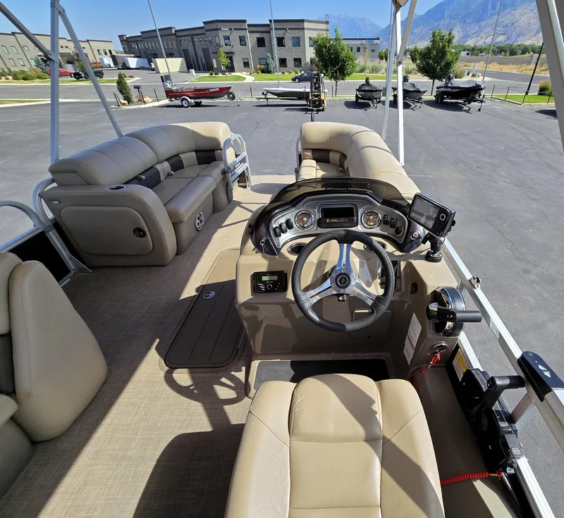 Slide: The Image of 2023 Sun Tracker SportFish 22 XP3 boat interior with steering console and seating. - 20